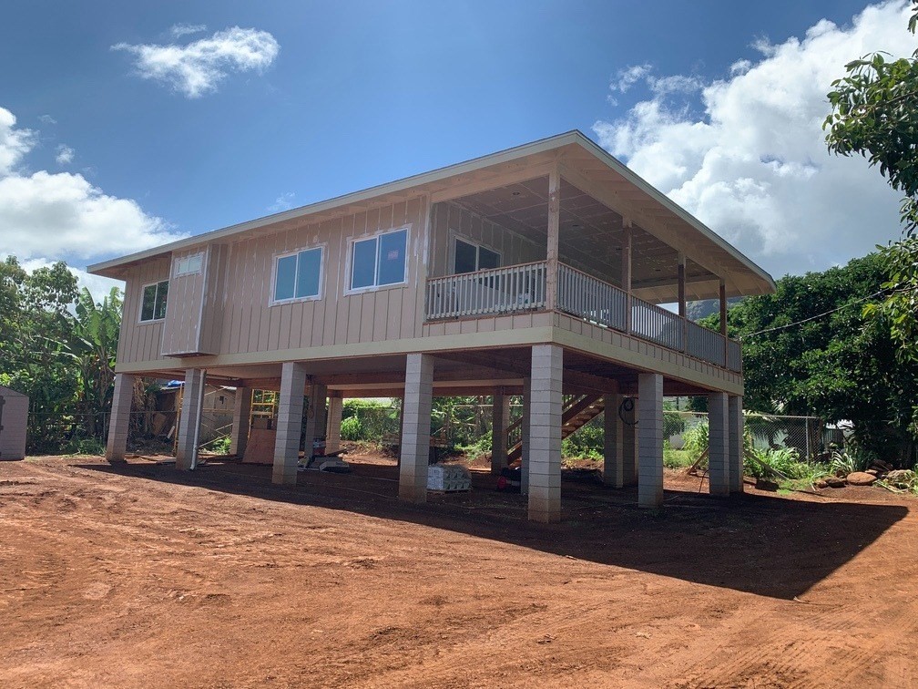402 Pua Road, Unit 1 Kapaa, HI 96746 - Photo 1 of 14 a front view of a house with a yard