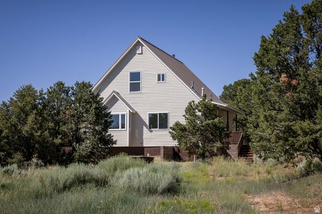 684 Blue Mountain Ridge Monticello, UT 84535 - Photo 8 of 71 View of property exterior featuring stairs and a deck