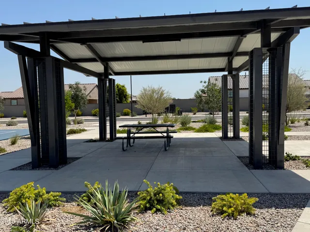 a view of a patio with table and chairs and potted plants