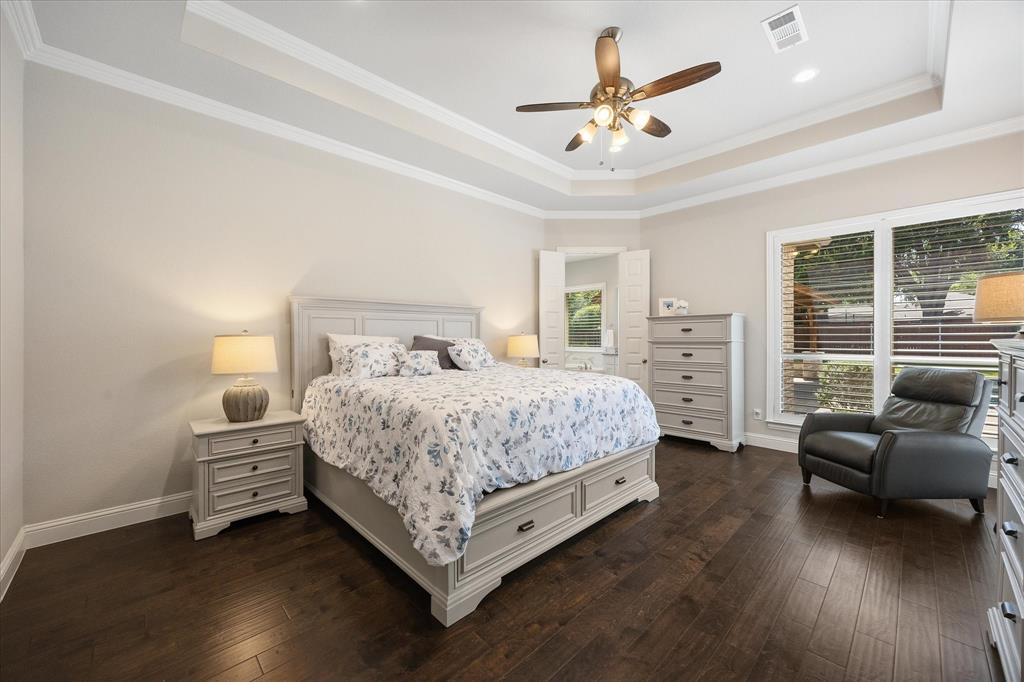 406 Prairie View Road Rockwall, TX 75087 - Photo 21 of 38 Master bedroom includes sitting area and breathtaking views of pool and outdoor area!