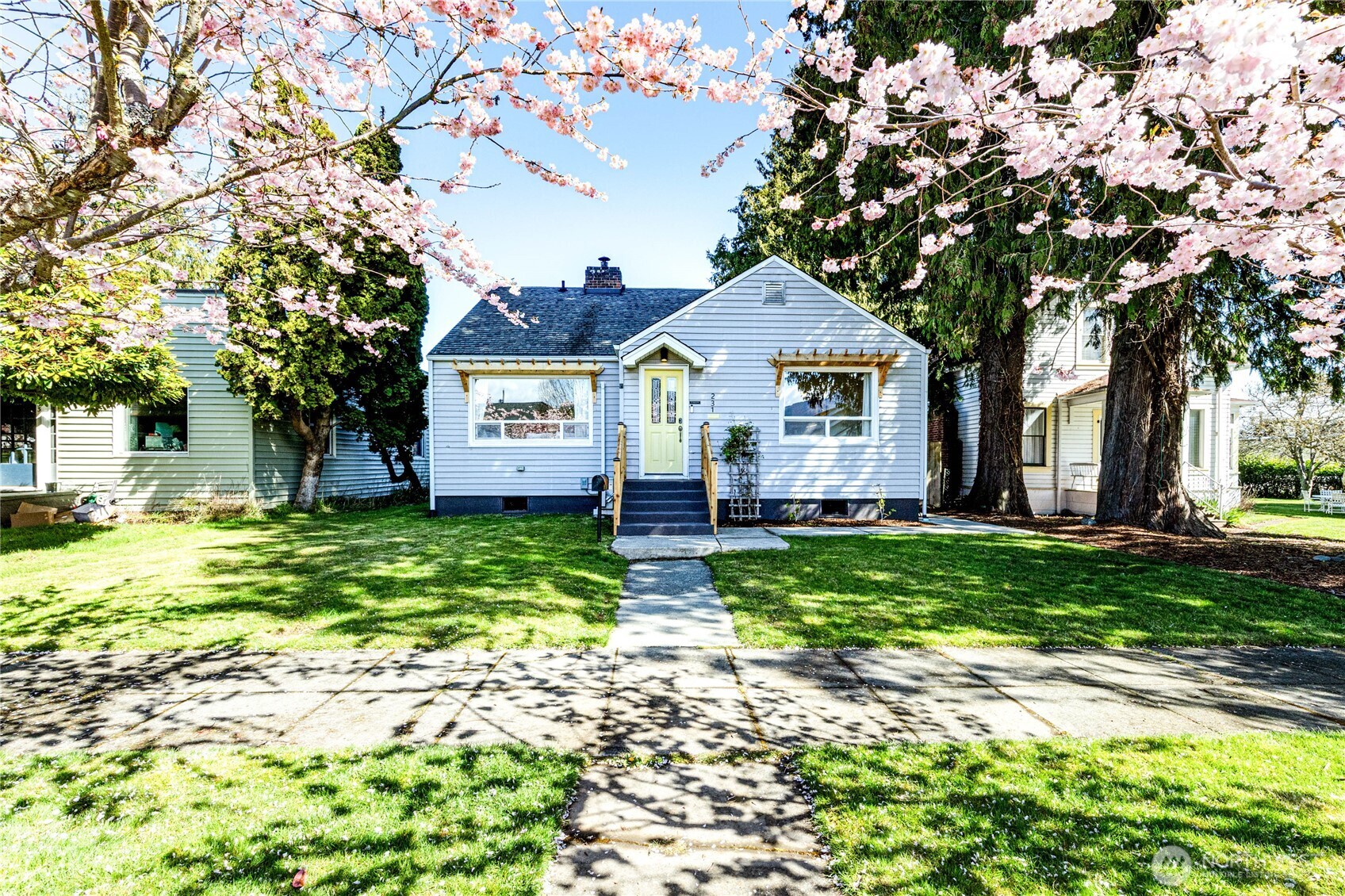 231 West 4th Street Port Angeles, WA 98362 - Photo 1 of 40 a front view of a house with a garden