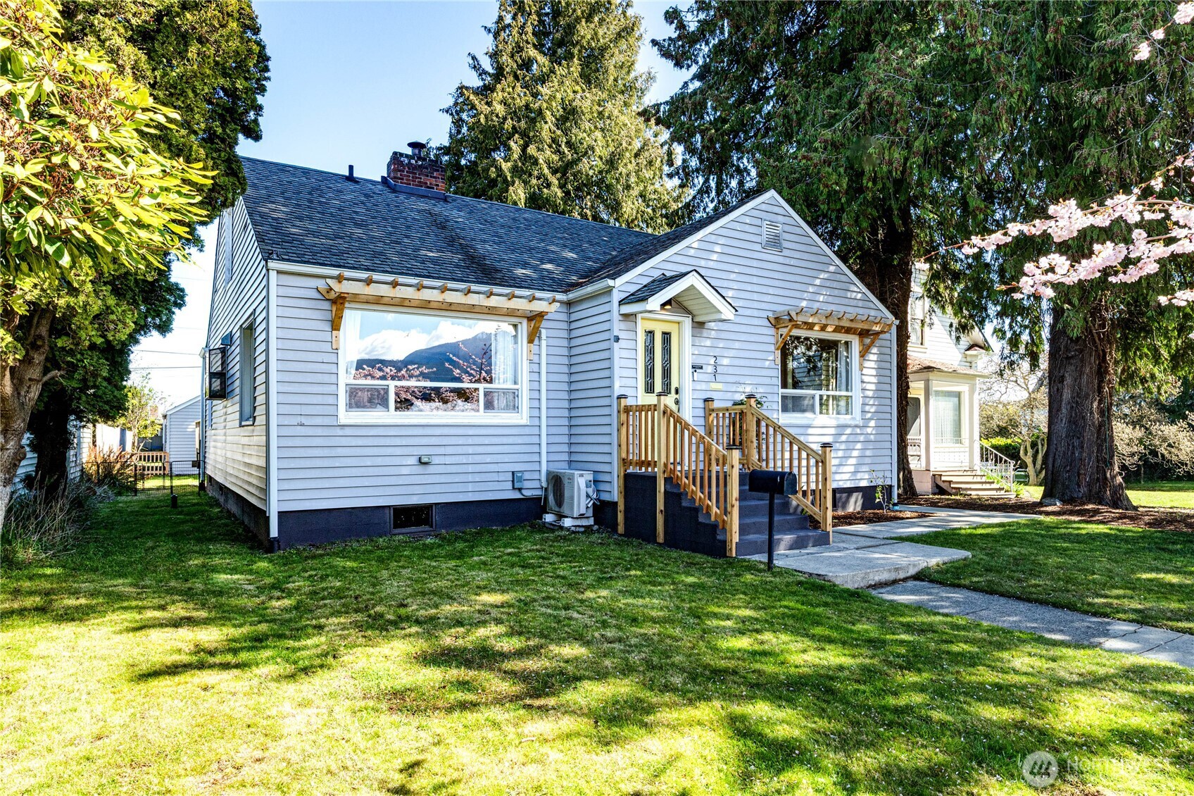 231 West 4th Street Port Angeles, WA 98362 - Photo 37 of 40 a front view of a house with a garden and deck