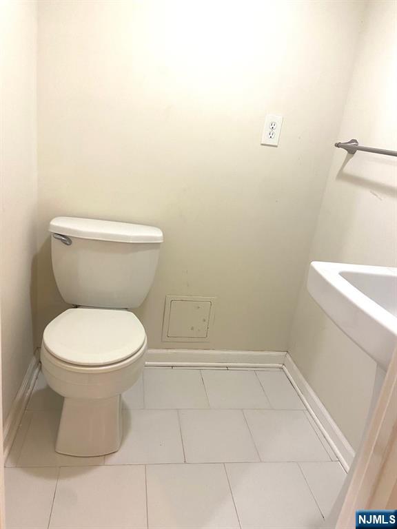 162 Union Place Ridgefield Park, NJ 07660 - Photo 12 of 21 a white toilet sitting next to a shower