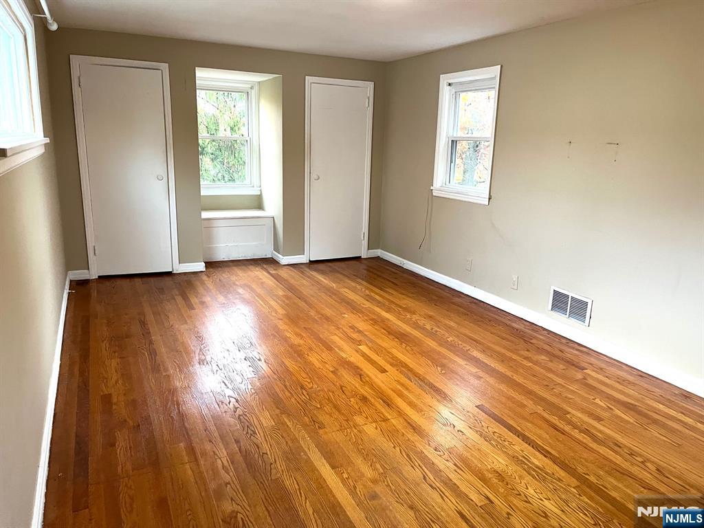 162 Union Place Ridgefield Park, NJ 07660 - Photo 15 of 21 a view of an empty room with wooden floor and a window