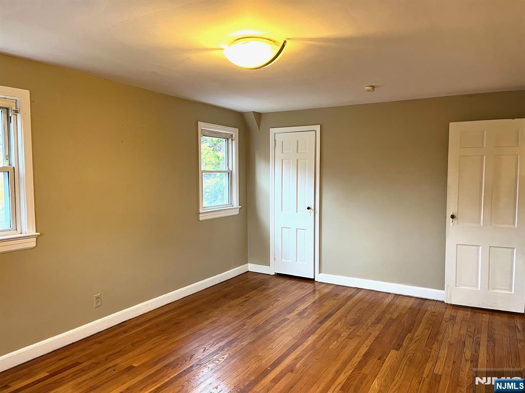 162 Union Place Ridgefield Park, NJ 07660 - Photo 17 of 21 a view of empty room with wooden floor and fan