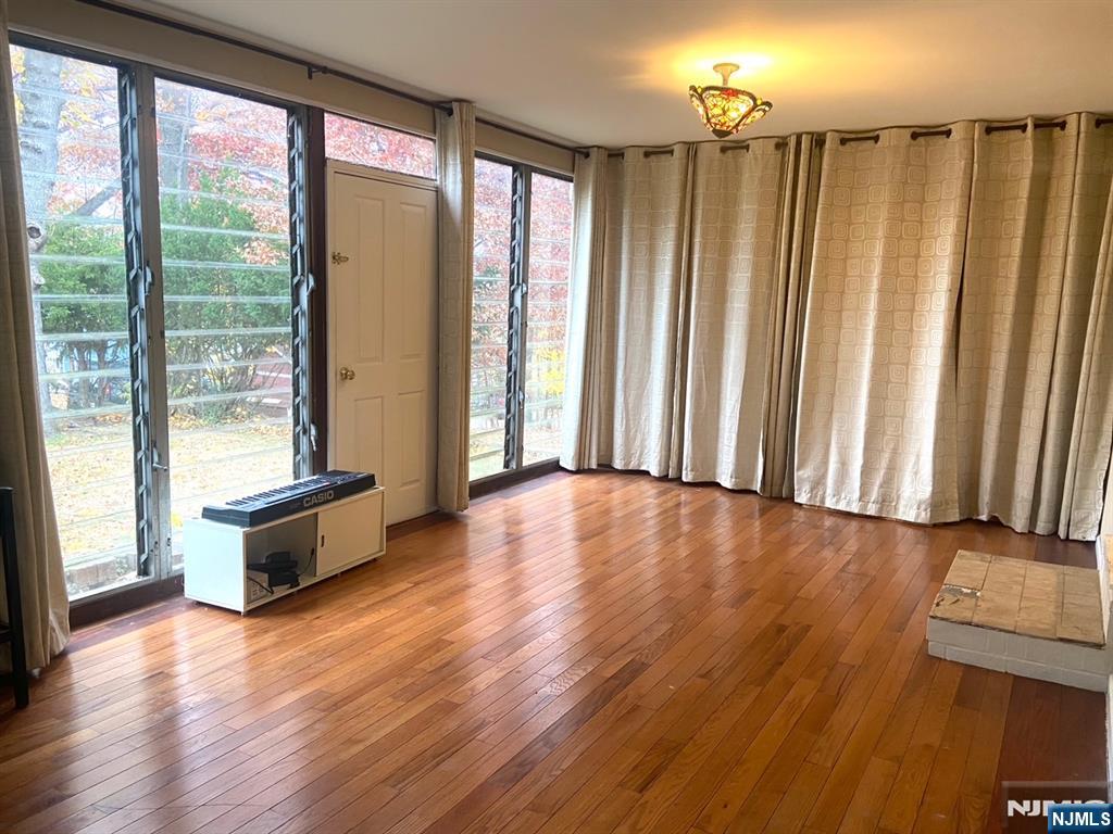 162 Union Place Ridgefield Park, NJ 07660 - Photo 7 of 21 a view of an empty room with wooden floor and a window