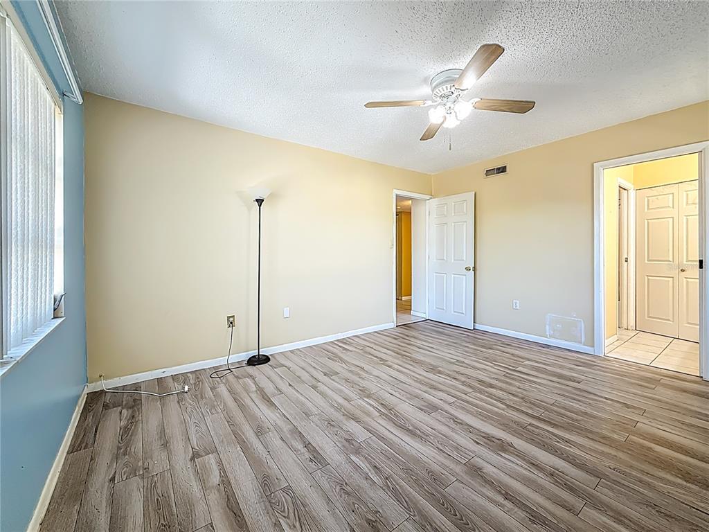 379 South McMullen Booth Road, Unit 76 Clearwater, FL 33759 - Photo 13 of 39 a view of a livingroom with a ceiling fan and window
