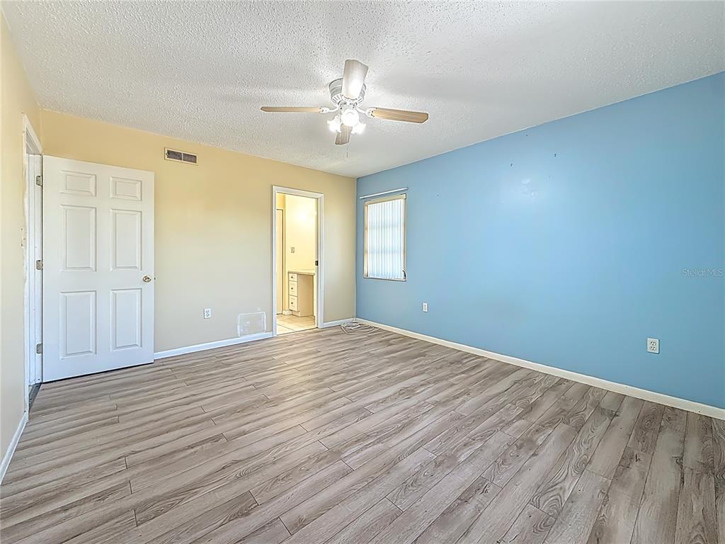 379 South McMullen Booth Road, Unit 76 Clearwater, FL 33759 - Photo 14 of 39 a view of an empty room with wooden floor