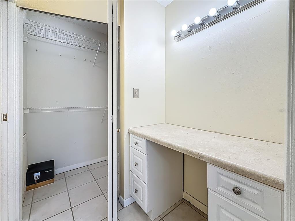 379 South McMullen Booth Road, Unit 76 Clearwater, FL 33759 - Photo 15 of 39 a utility room with cabinets