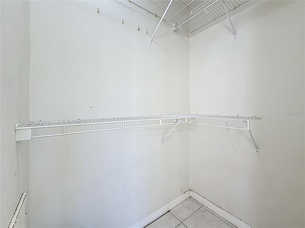379 South McMullen Booth Road, Unit 76 Clearwater, FL 33759 - Photo 17 of 39 a view of a room with racks on the wall