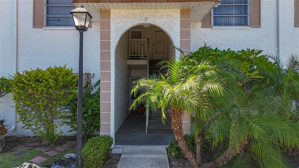 379 South McMullen Booth Road, Unit 76 Clearwater, FL 33759 - Photo 2 of 39 a picture of a building with a small yard