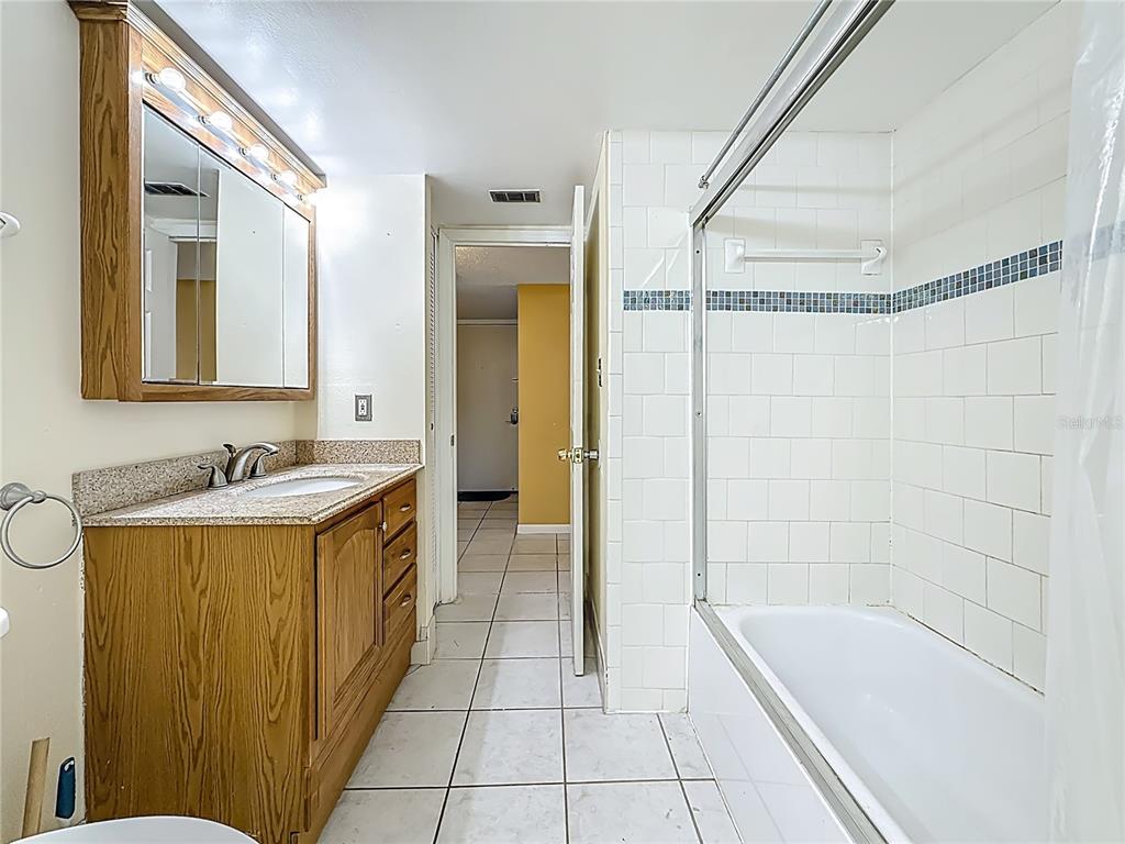 379 South McMullen Booth Road, Unit 76 Clearwater, FL 33759 - Photo 22 of 39 a bathroom with a tub sink and mirror