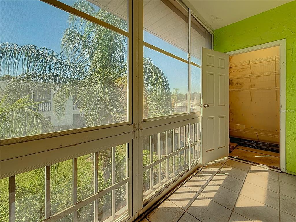 379 South McMullen Booth Road, Unit 76 Clearwater, FL 33759 - Photo 27 of 39 a view of a porch with a door