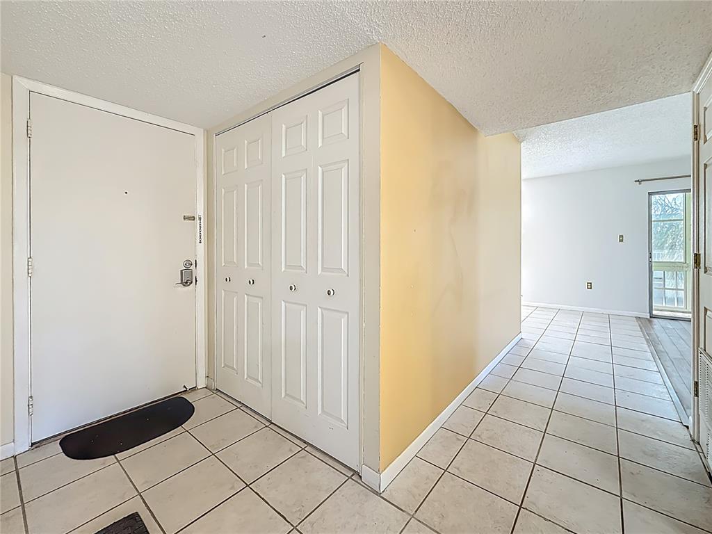 379 South McMullen Booth Road, Unit 76 Clearwater, FL 33759 - Photo 3 of 39 a view of a livingroom with an empty space and a window
