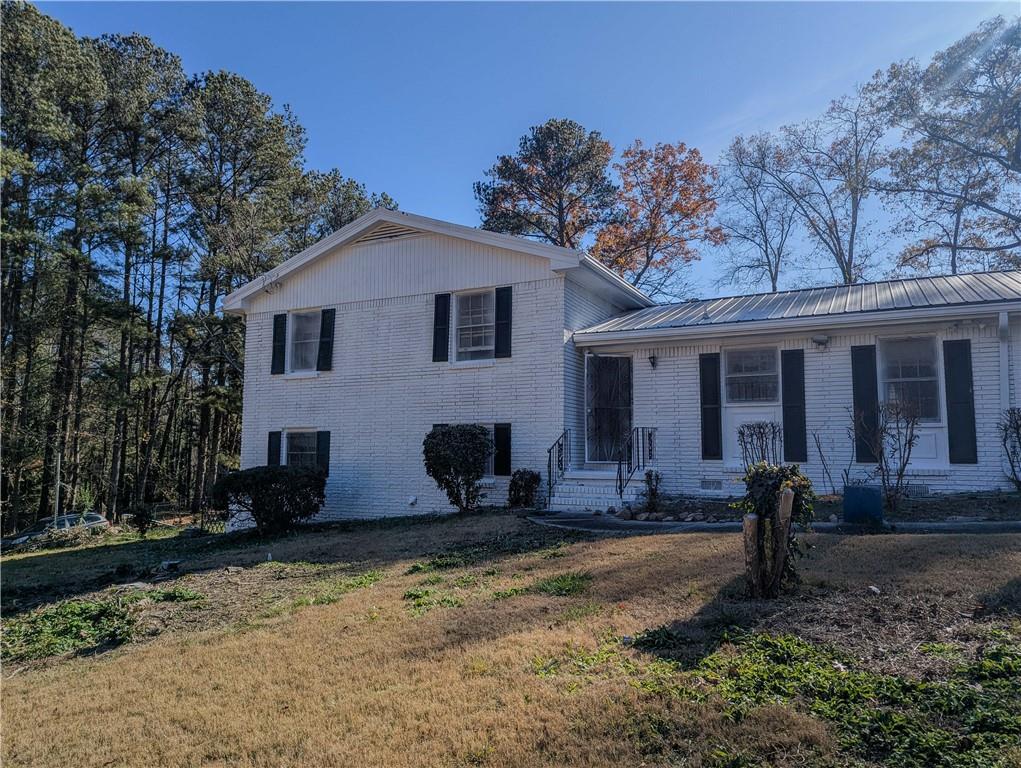 4628 Tucson Trail Southwest Atlanta, GA 30331 - Photo 1 of 29 a front view of a house with garden