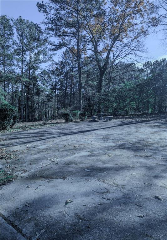 4628 Tucson Trail Southwest Atlanta, GA 30331 - Photo 13 of 29 a backyard of a house with lots of green space