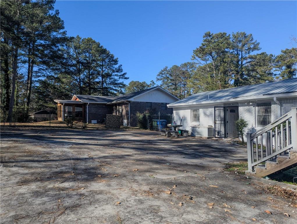 4628 Tucson Trail Southwest Atlanta, GA 30331 - Photo 2 of 29 a view of a house with a yard and sitting area
