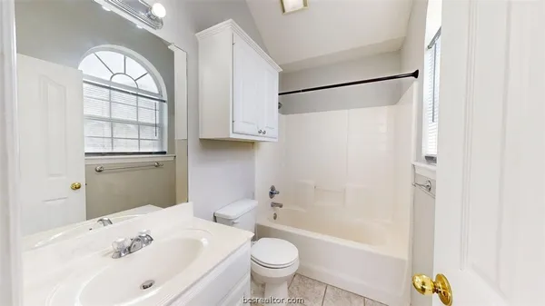 a bathroom with a bathtub toilet a sink and a shower