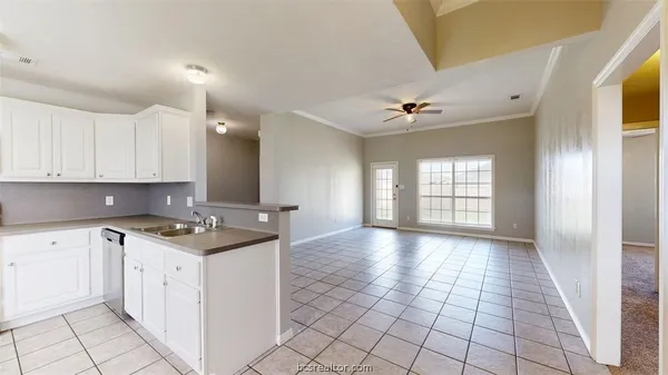 a kitchen with a stove a sink and a refrigerator