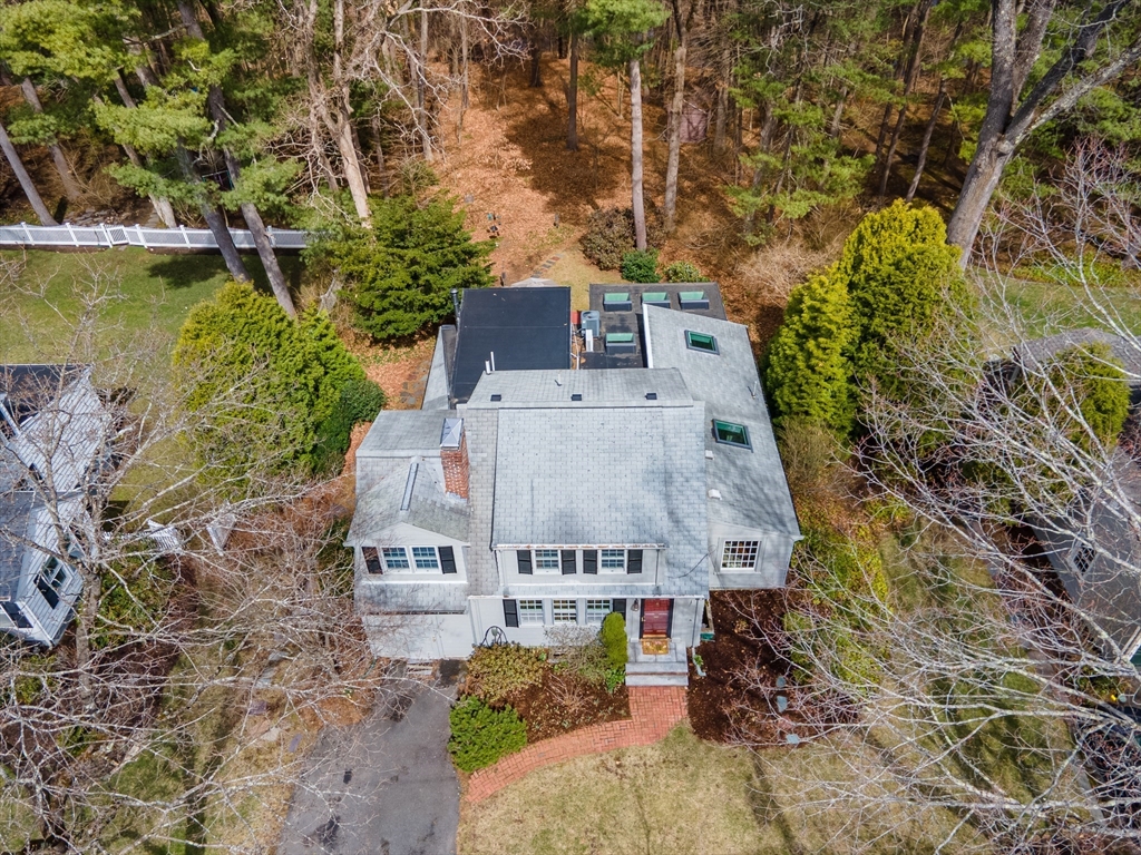 77 Parker Road Wellesley, MA 02482 - Photo 1 of 19 an aerial view of a house with a garden
