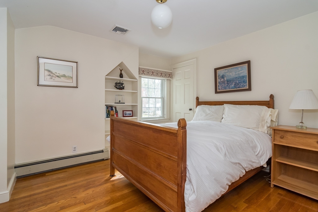 77 Parker Road Wellesley, MA 02482 - Photo 15 of 19 a bedroom with a bed and a window