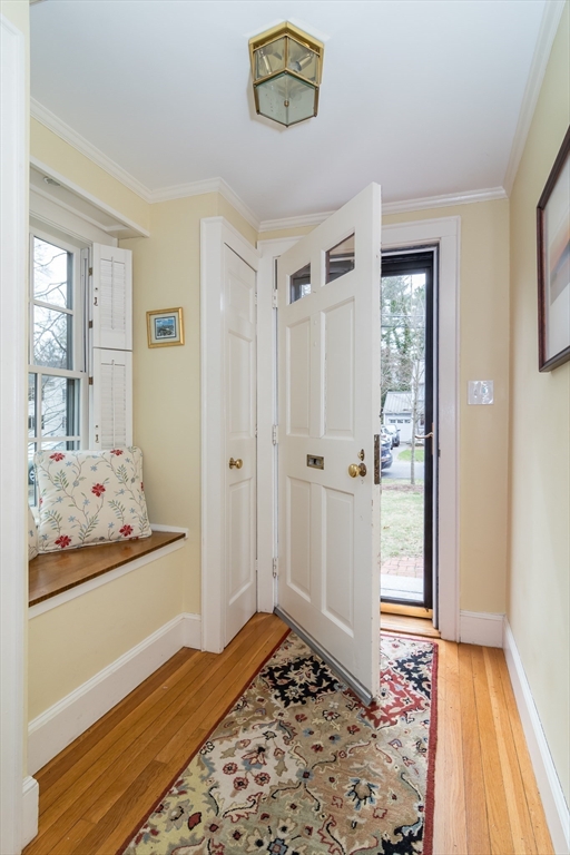 77 Parker Road Wellesley, MA 02482 - Photo 4 of 19 a bedroom with a bed and wooden floor