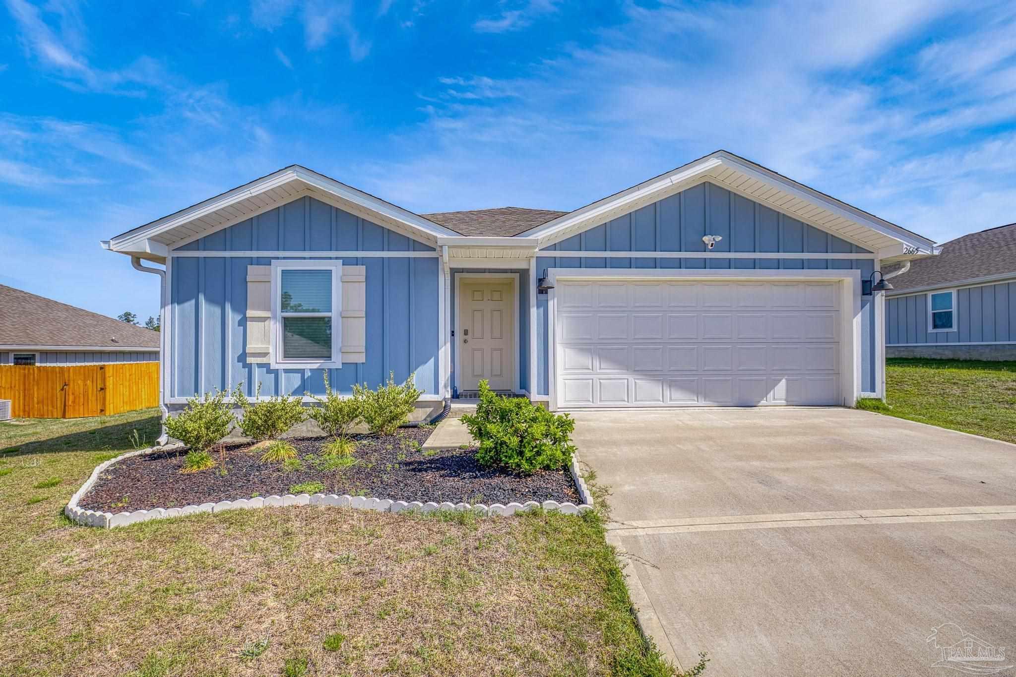 2665 Saltgrass Way Crestview, FL 32536 - Photo 16 of 22 a front view of a house with garden