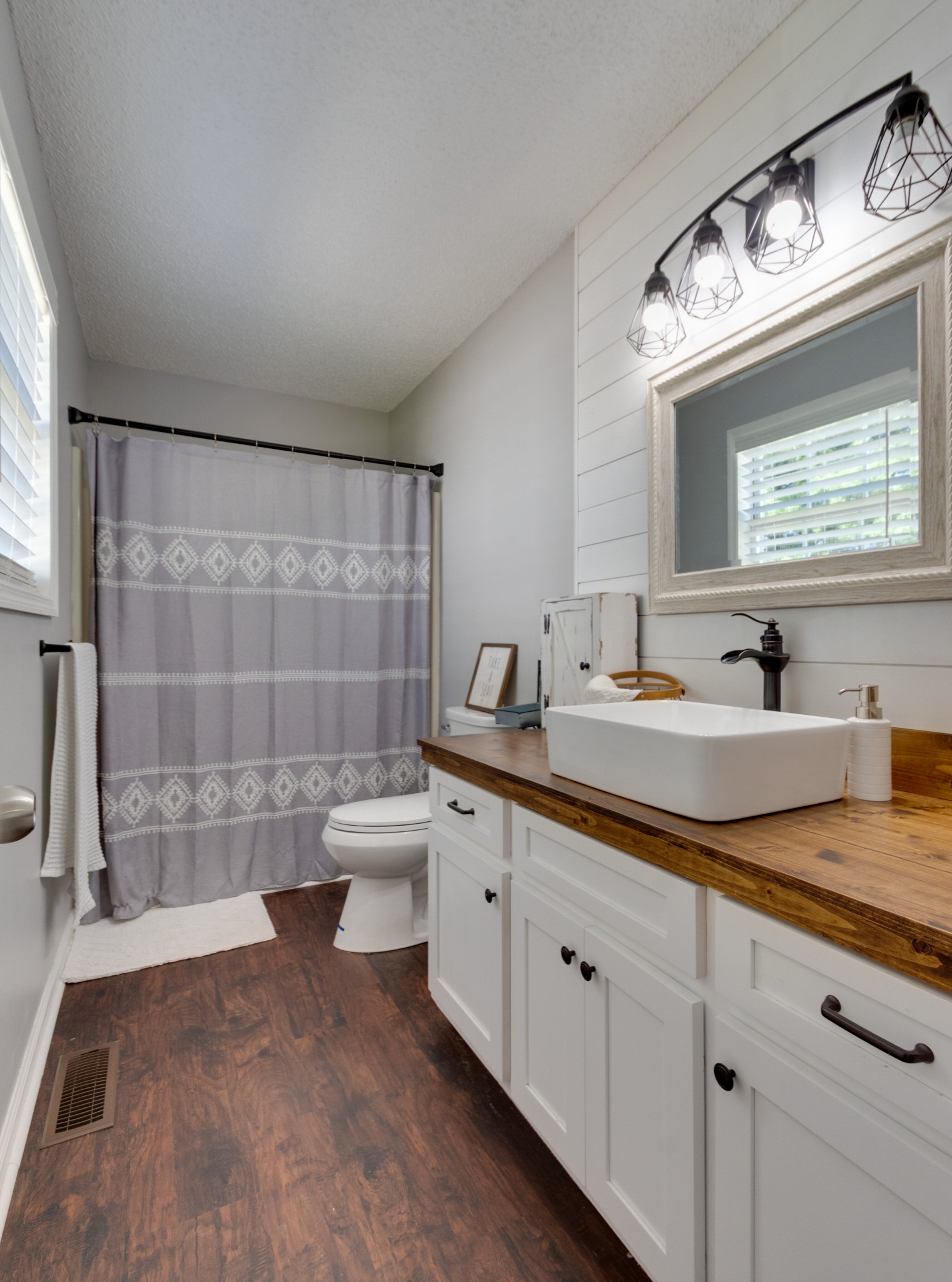 1345 Shores Road Goodspring, TN 38460 - Photo 11 of 21 a bathroom with a double vanity sink a toilet and a mirror