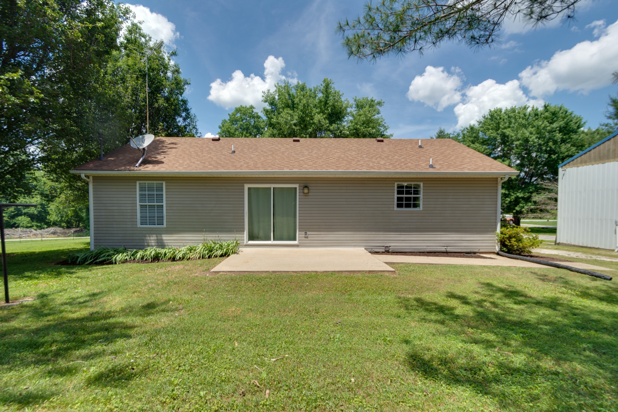 1345 Shores Road Goodspring, TN 38460 - Photo 15 of 21 a front view of a house with a garden and yard
