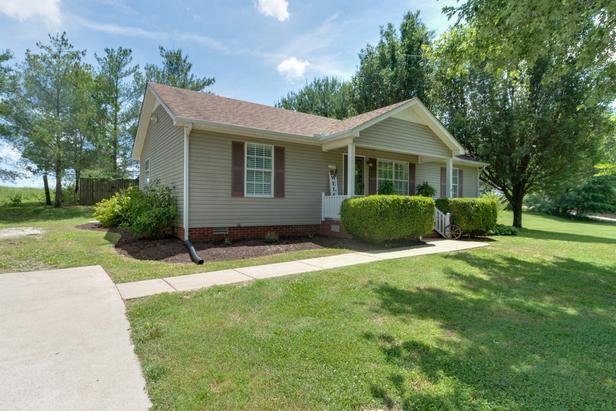 1345 Shores Road Goodspring, TN 38460 - Photo 3 of 21 a view of a house with a yard and potted plants