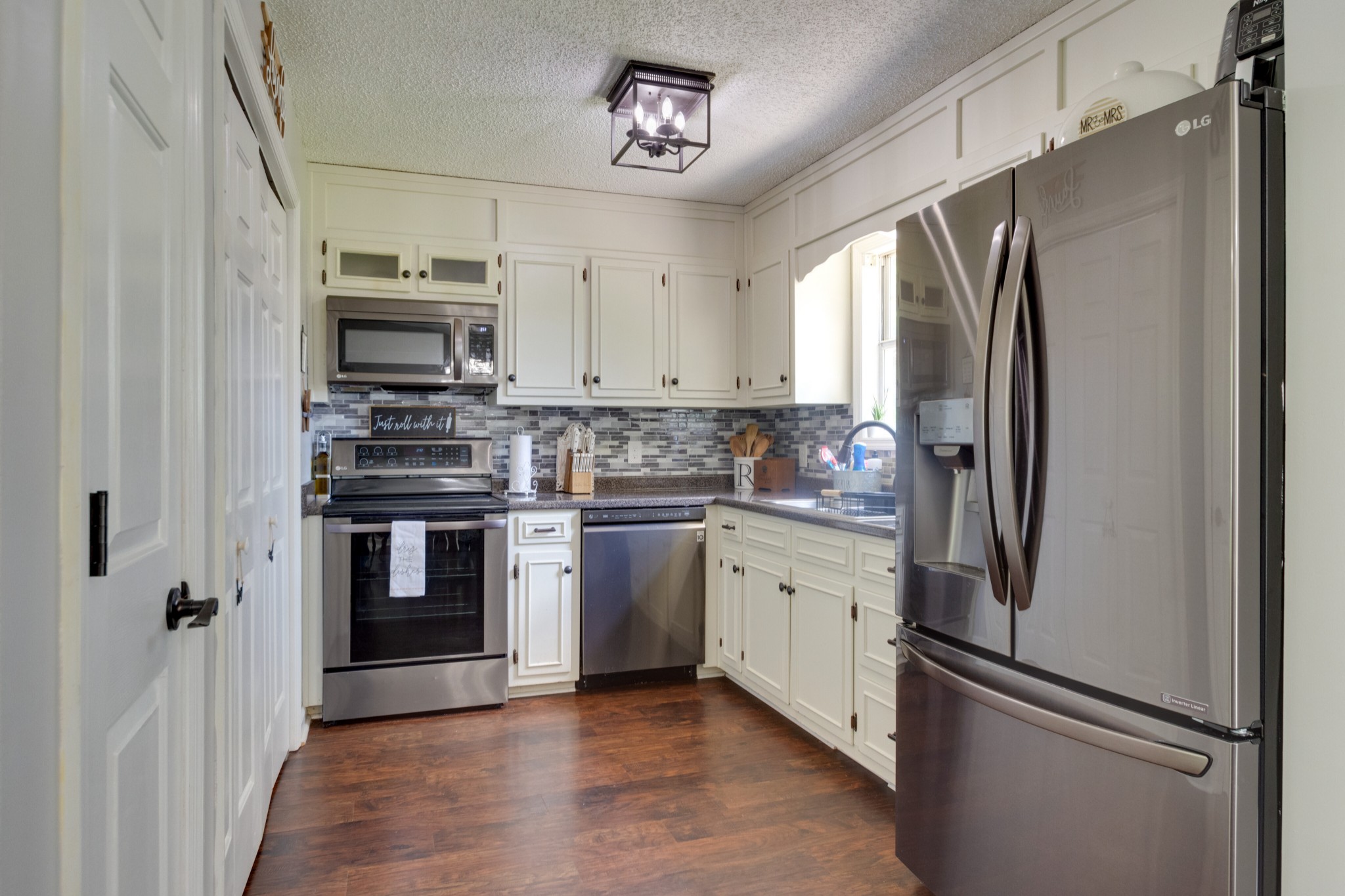 1345 Shores Road Goodspring, TN 38460 - Photo 7 of 21 a kitchen with stainless steel appliances a refrigerator stove and sink