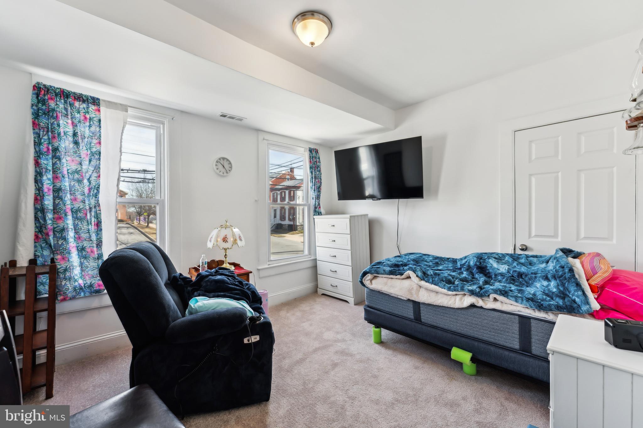 9 Carroll Street Westminster, MD 21157 - Photo 17 of 30 a living room with furniture and a flat screen tv