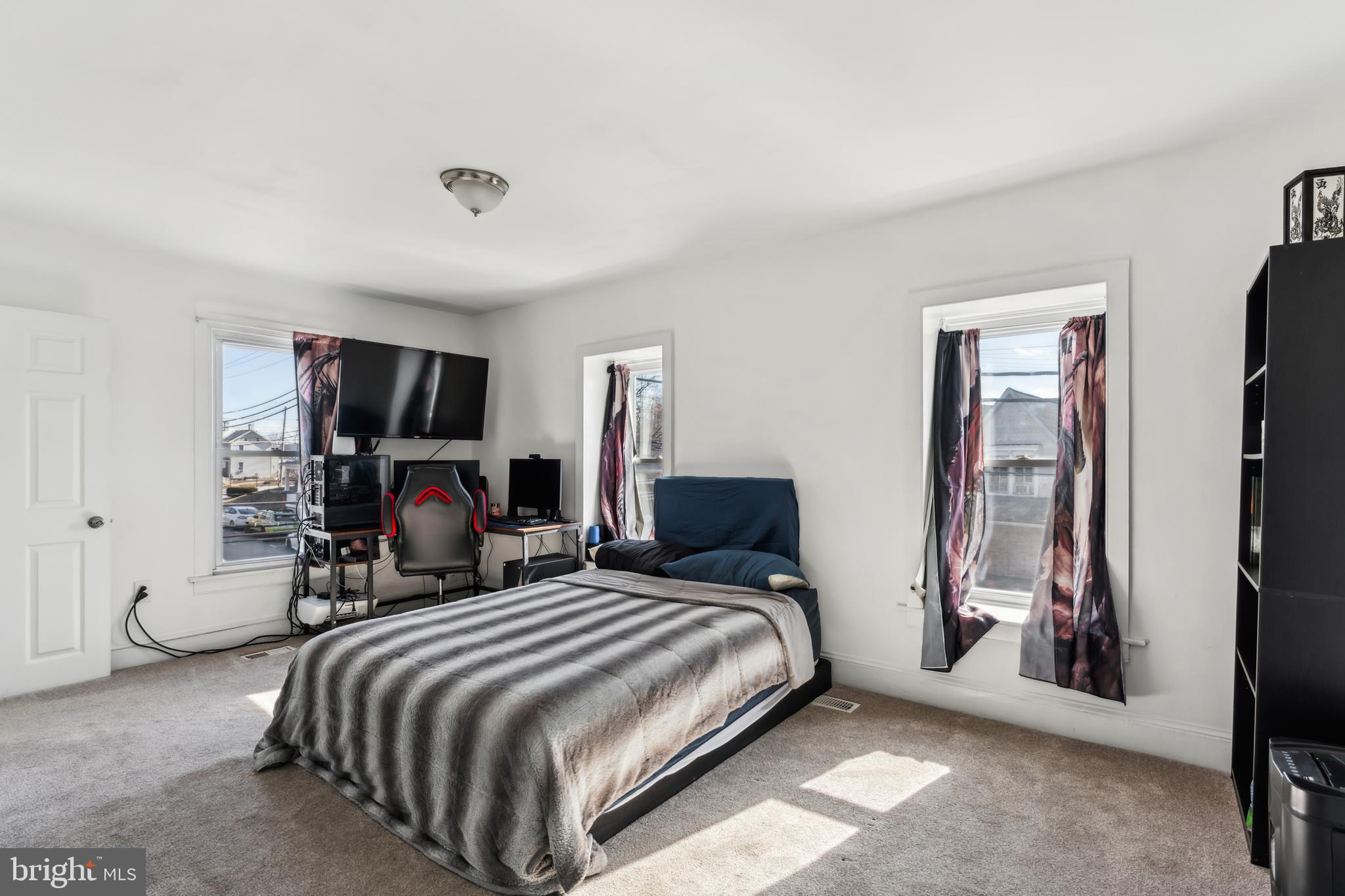 9 Carroll Street Westminster, MD 21157 - Photo 19 of 30 a bedroom with a bed furniture and a flat tv screen