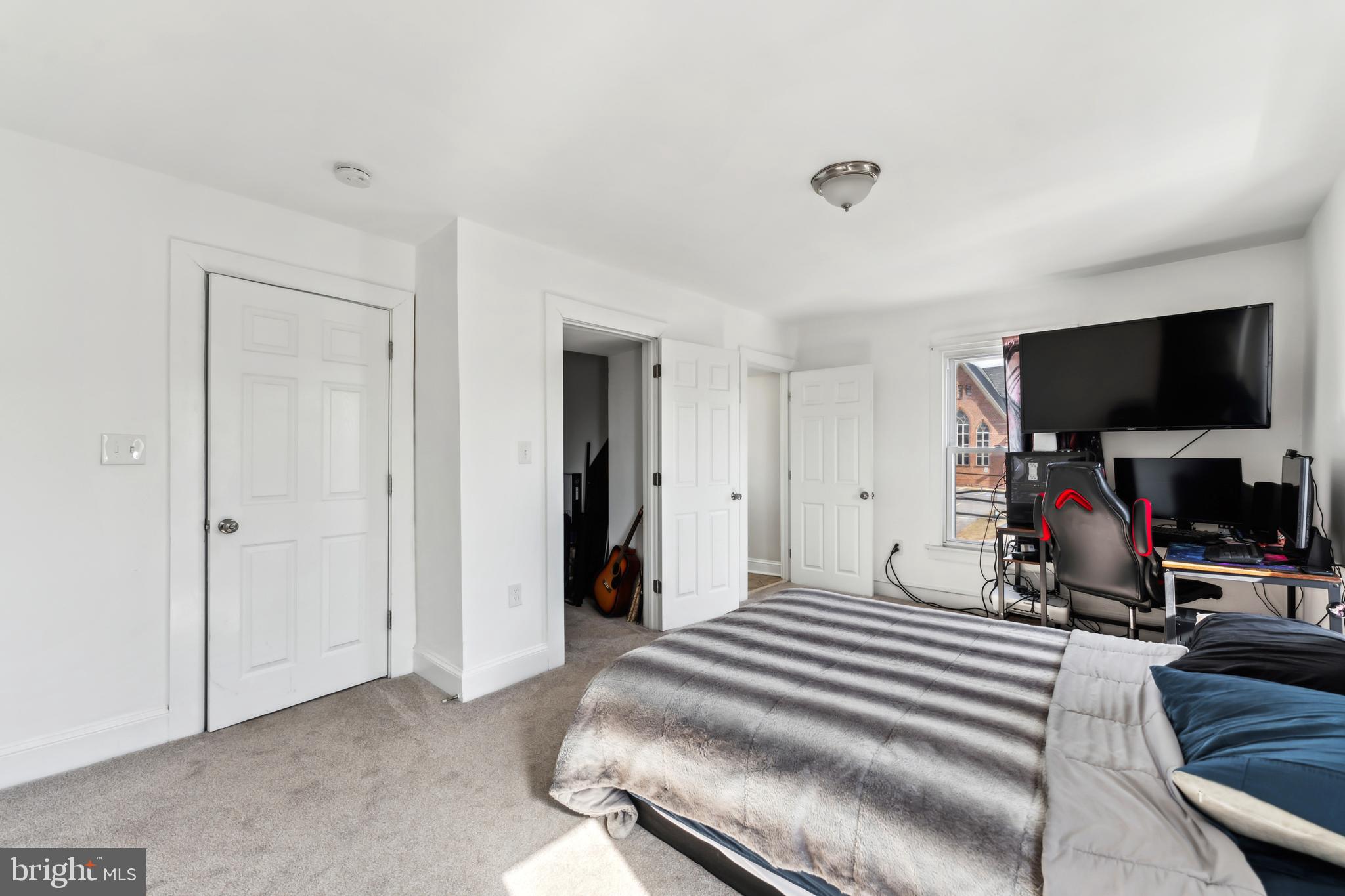 9 Carroll Street Westminster, MD 21157 - Photo 20 of 30 a bedroom with a bed and a flat screen tv