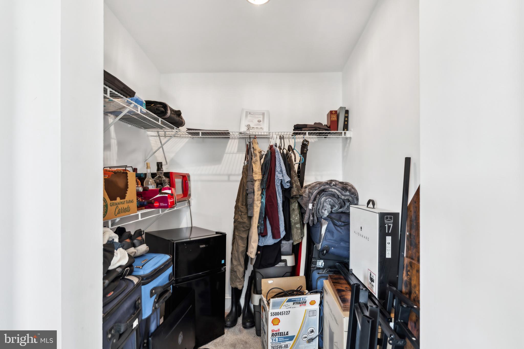 9 Carroll Street Westminster, MD 21157 - Photo 21 of 30 a view of walk in closet with clothes and shoes