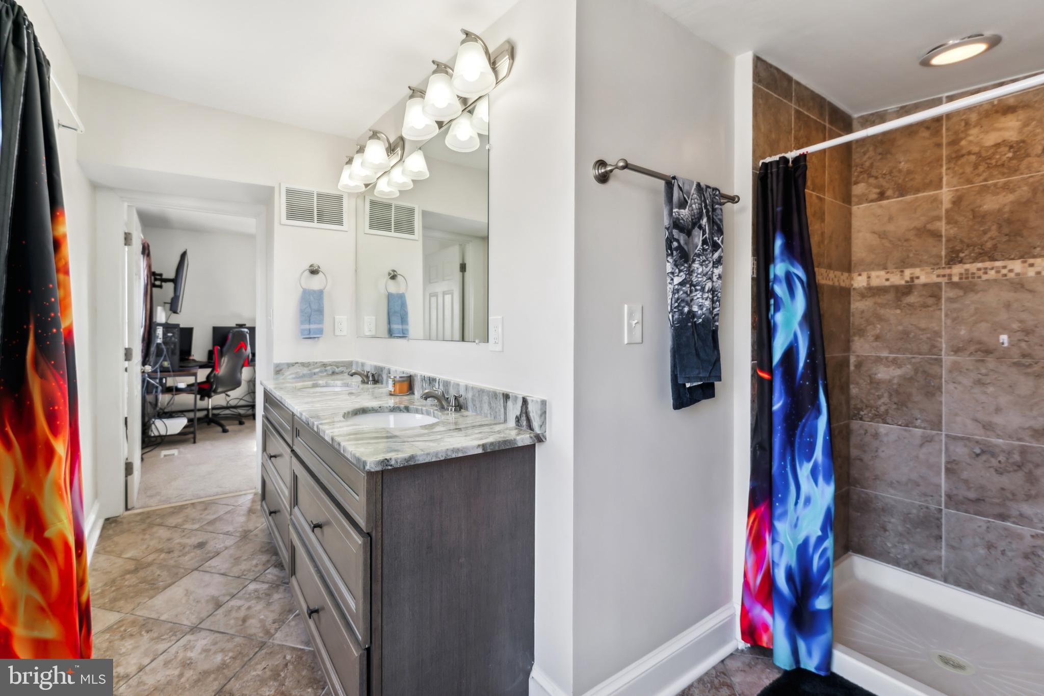 9 Carroll Street Westminster, MD 21157 - Photo 23 of 30 a bathroom with a sink vanity mirror and shower