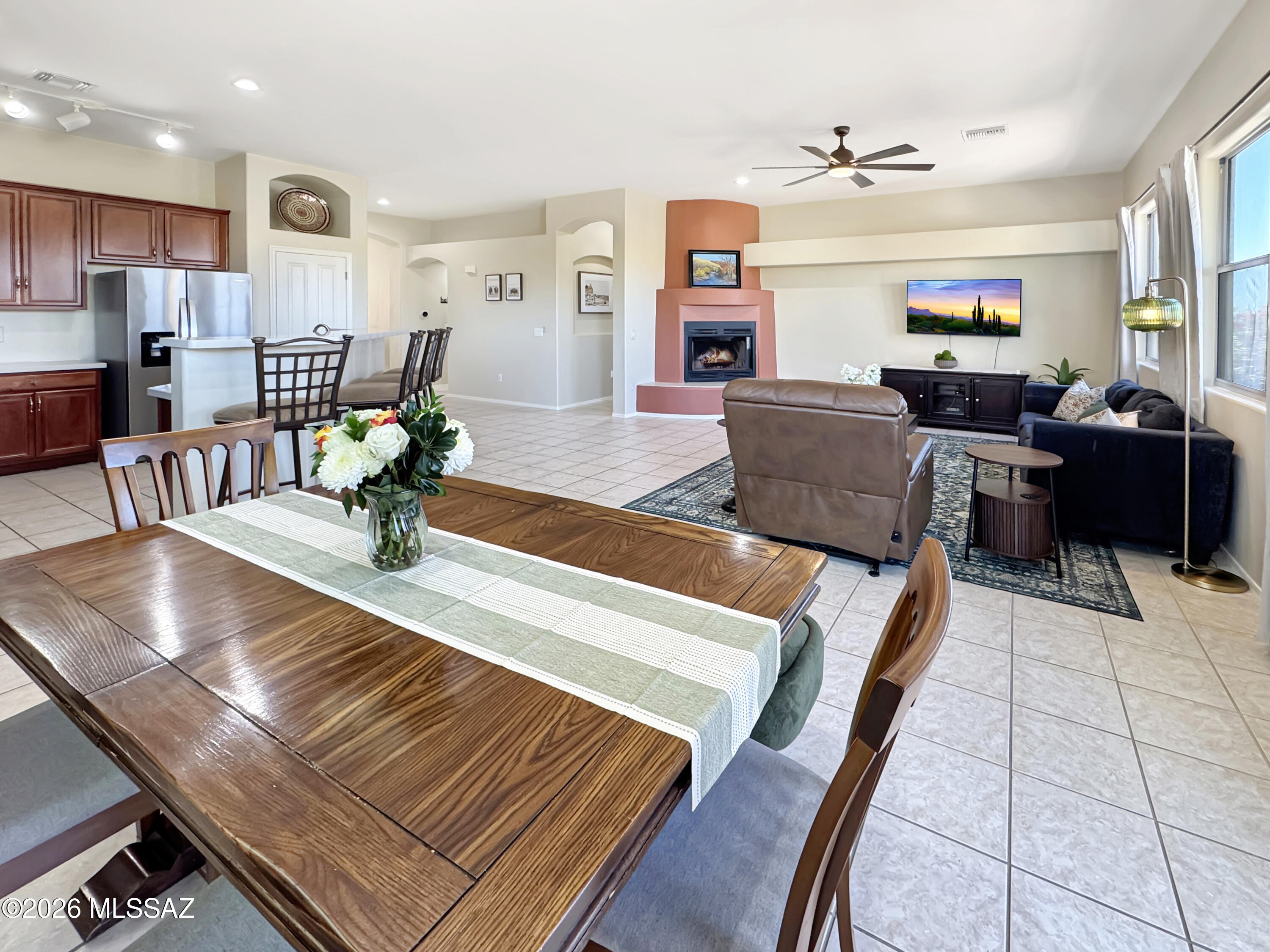 10835 South Heart Break Ridge Place Vail, AZ 85641 - Photo 14 of 49 a living room with furniture and a dining table with wooden floor
