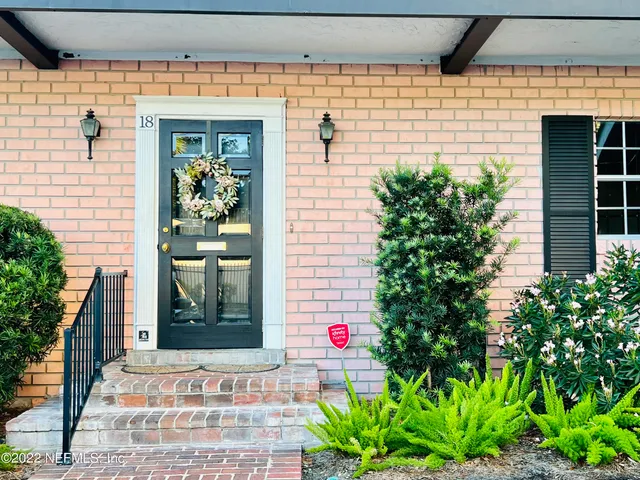 a front view of a house with a garage