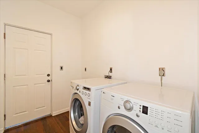 a view of storage and utility room with washer and dryer