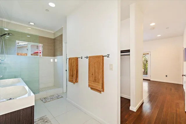 a bathroom with a shower and a sink