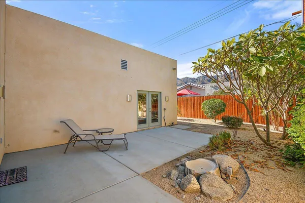 a view of backyard with outdoor seating
