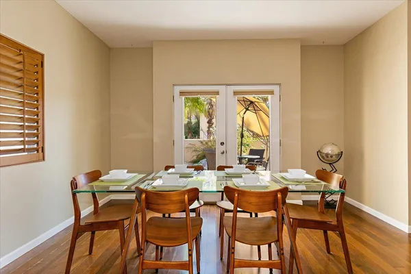 a dining room with furniture and window