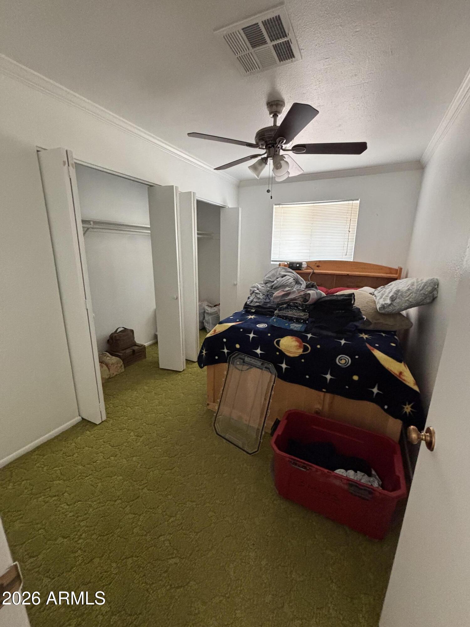 6508 West Fremont Road Laveen, AZ 85339 - Photo 13 of 32 a bedroom with furniture and a ceiling fan