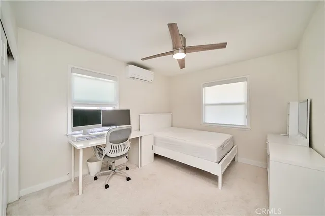 a room with a bed and a table in it