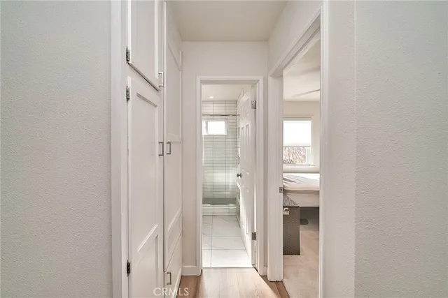 a view of a bathroom from a hallway with toilet