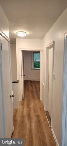 a kitchen with a stove a refrigerator and a sink