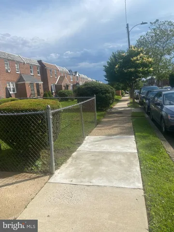 a view of wooden floor and windows in a room