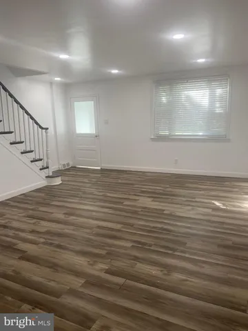 a kitchen with a sink stove top oven and cabinets
