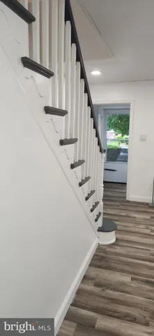 a view of a living room and kitchen