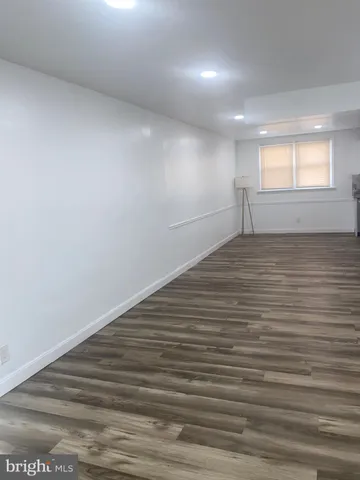 a kitchen with a sink a stove and cabinets